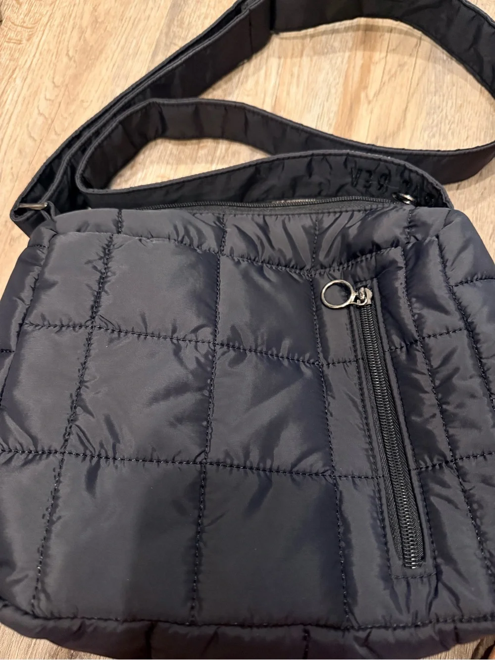 Black Quilted Crossbody Bag with Front Zip Pocket